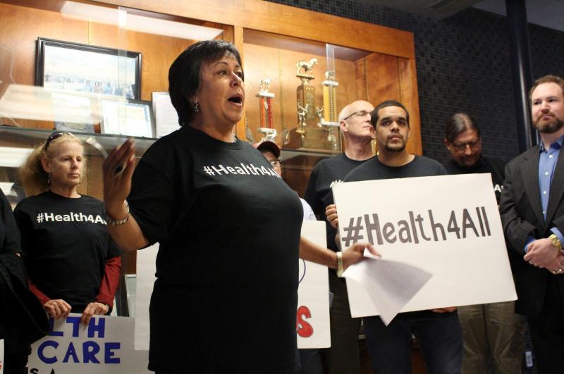 Jane Garcia, CEO of La Clinica de la Raza, which serves 25,000 patients in Contra Costa County, Calif., addresses supporters of expanding health care for undocumented adults. Jane Garcia, CEO of La Clinica de la Raza, which serves 25,000 patients in Contra Costa County, Calif., addresses supporters of expanding health care for undocumented adults.