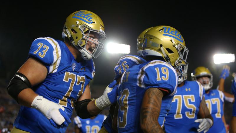 UCLA players celebrate during a game against the Arizona Wildcats at the Rose Bowl last year in Pasadena, Calif. Gov. Gavin Newsom has signed a bill paving the way for college athletes in the state to hire agents and sign endorsement deals. UCLA players celebrate during a game against the Arizona Wildcats at the Rose Bowl last year in Pasadena, Calif. Gov. Gavin Newsom has signed a bill paving the way for college athletes in the state to hire agents and sign endorsement deals.