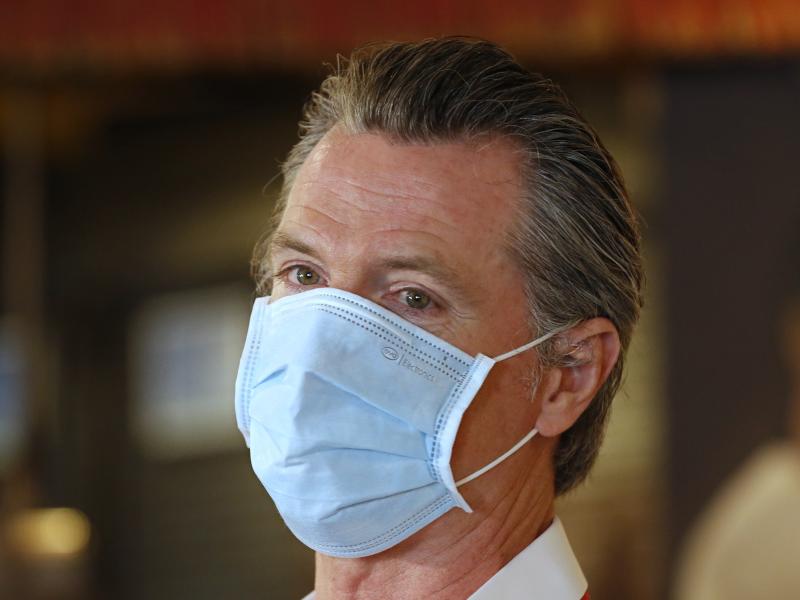 California Gov. Gavin Newsom, here in Sacramento on Friday, has ordered face coverings be required in public spaces statewide. California Gov. Gavin Newsom, here in Sacramento on Friday, has ordered face coverings be required in public spaces statewide.