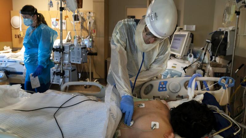 A patient is treated for COVID-19 at Providence Holy Cross Medical Center in Los Angeles. Hospitalizations because of the coronavirus are surging in California. A patient is treated for COVID-19 at Providence Holy Cross Medical Center in Los Angeles. Hospitalizations because of the coronavirus are surging in California.