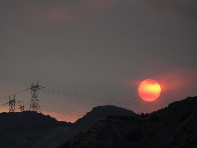 The sun sets through smoke created by the Ranch Fire this week in Azusa, Calif. The heat wave will likely hinder firefighting efforts, but at least the strong winds that fuel wildfires are not expected. The sun sets through smoke created by the Ranch Fire this week in Azusa, Calif. The heat wave will likely hinder firefighting efforts, but at least the strong winds that fuel wildfires are not expected.