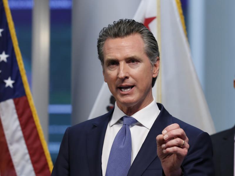 California Gov. Gavin Newsom gives an update to the state's response to the coronavirus, at the Governor's Office of Emergency Services in Rancho Cordova, Calif., on Tuesday. California Gov. Gavin Newsom gives an update to the state's response to the coronavirus, at the Governor's Office of Emergency Services in Rancho Cordova, Calif., on Tuesday.
