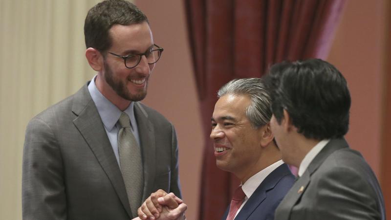 State Sen. Scott Wiener, D-San Francisco, left, receives congratulations from Assemblyman Rob Bonta, D-Alameda, center, and Sen. Kevin de Leon, D-Los Angeles, right, after passage of the bill Friday in Sacramento. State Sen. Scott Wiener, D-San Francisco, left, receives congratulations from Assemblyman Rob Bonta, D-Alameda, center, and Sen. Kevin de Leon, D-Los Angeles, right, after passage of the bill Friday in Sacramento.