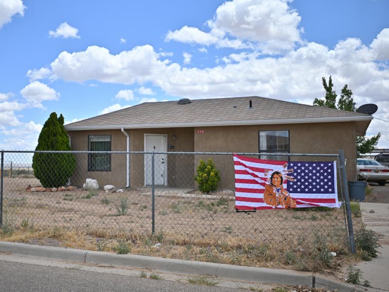 An American flag with an image of a Native American on it in To'Hajiilee Indian Reservation in New Mexico. In California, a vaccine allocation committee is considering taking historical injustice into account in advance of a statewide rollout. An American flag with an image of a Native American on it in To'Hajiilee Indian Reservation in New Mexico. In California, a vaccine allocation committee is considering taking historical injustice into account in advance of a statewide rollout.