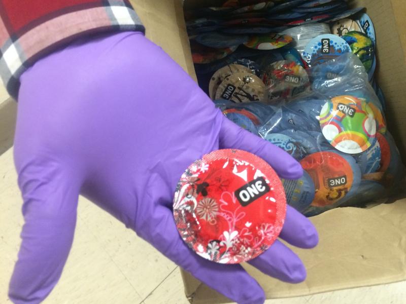 A Los Angeles County Department of Public Health worker shows condoms for weekly distribution to inmates in the Men's Central Jail. A Los Angeles County Department of Public Health worker shows condoms for weekly distribution to inmates in the Men's Central Jail.