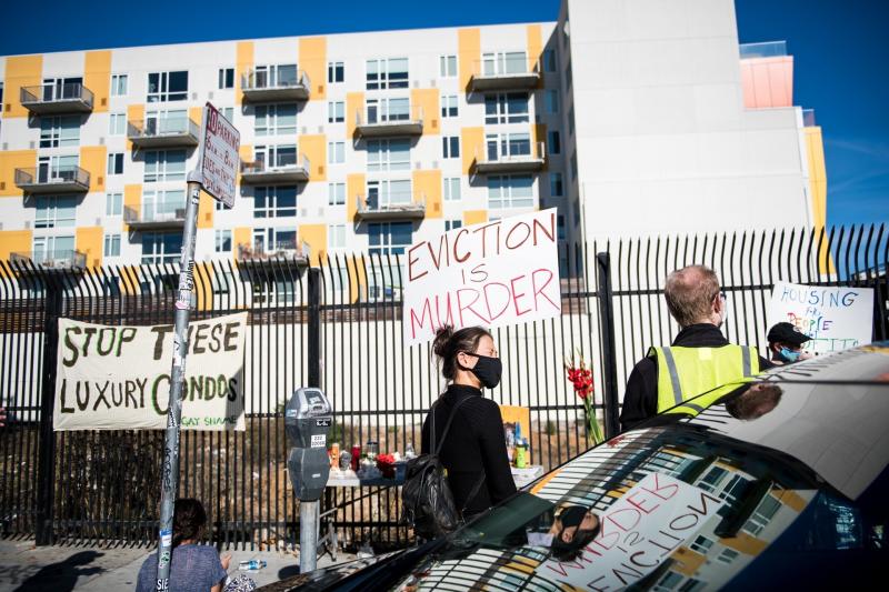 A demonstrator holds a sign in the Mission in San Francisco on Nov, 16 calling for shelter-in-place hotel rooms to remain available for unhoused residents. A demonstrator holds a sign in the Mission in San Francisco on Nov, 16 calling for shelter-in-place hotel rooms to remain available for unhoused residents.