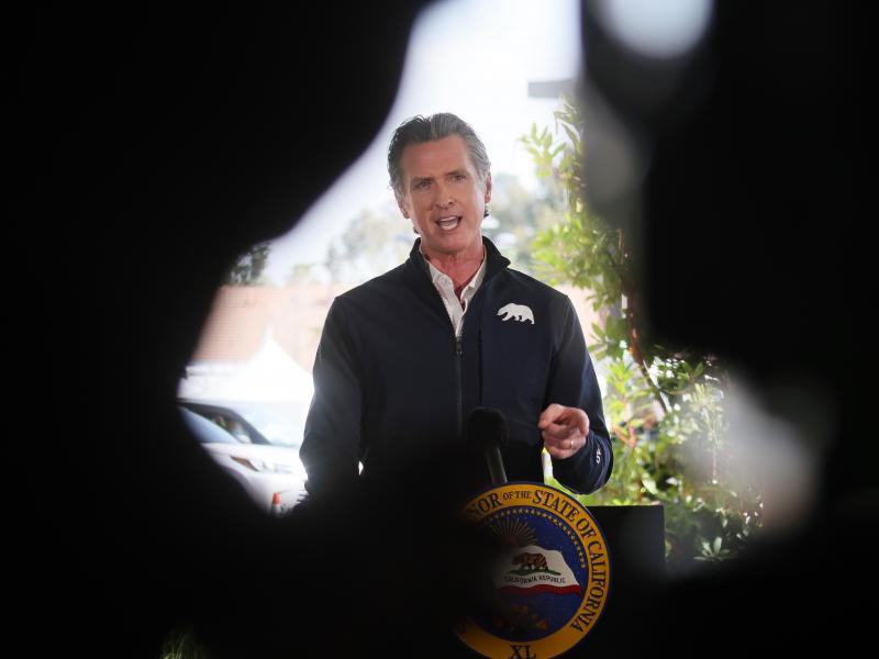 California Governor Gavin Newsom speaks at a press conference following the opening of a new large scale COVID-19 vaccination site in Los Angeles on Tuesday. Newsom says the state will start setting aside 10% of its vaccine allotment for teachers, day car California Governor Gavin Newsom speaks at a press conference following the opening of a new large scale COVID-19 vaccination site in Los Angeles on Tuesday. Newsom says the state will start setting aside 10% of its vaccine allotment for teachers, day car