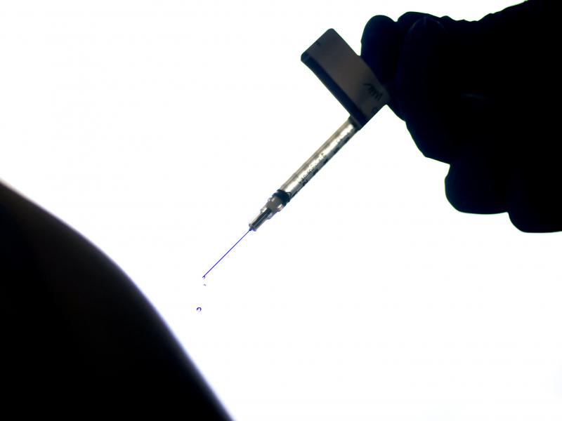 A health care worker in Rhode Island receives a dose of the Pfizer/BioNTech vaccine last December. California is implementing a vaccine mandate for all paid and unpaid workers in the health care industry starting Sept. 30. A health care worker in Rhode Island receives a dose of the Pfizer/BioNTech vaccine last December. California is implementing a vaccine mandate for all paid and unpaid workers in the health care industry starting Sept. 30.