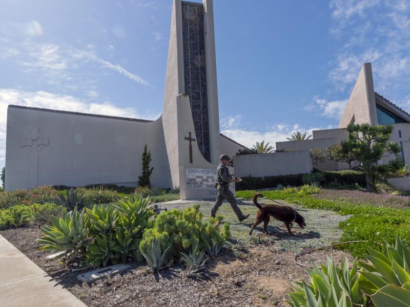 An Orange County Sheriff's Department K-9 unit checks the grounds at Geneva Presbyterian Church in Laguna Woods, Calif. on Sunday after a fatal shooting. An Orange County Sheriff's Department K-9 unit checks the grounds at Geneva Presbyterian Church in Laguna Woods, Calif. on Sunday after a fatal shooting.