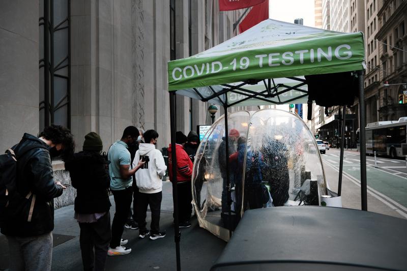 People line up to get tested for COVID at a site in New York City on Monday. The new omicron variant, first detected in South Africa, is quickly spreading around the world. People line up to get tested for COVID at a site in New York City on Monday. The new omicron variant, first detected in South Africa, is quickly spreading around the world.