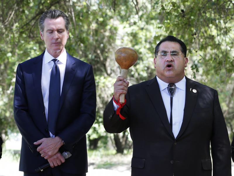 Gov. Gavin Newsom, left, bows his head as Assemblyman James Ramos opens a meeting with tribal leaders from around the state in 2019 in West Sacramento, Calif. In 2021, Ramos authored, and Newsom signed, a law to erect a monument to Native Americans in Sac Gov. Gavin Newsom, left, bows his head as Assemblyman James Ramos opens a meeting with tribal leaders from around the state in 2019 in West Sacramento, Calif. In 2021, Ramos authored, and Newsom signed, a law to erect a monument to Native Americans in Sac