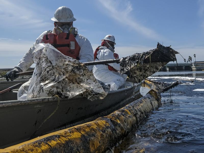 Cleanup contractors deploy skimmers and floating barriers known as booms to try to stop further crude oil incursion into Talbert Marsh in Huntington Beach, Calif., on Oct. 3 after an oil spill off the Southern California coast. Cleanup contractors deploy skimmers and floating barriers known as booms to try to stop further crude oil incursion into Talbert Marsh in Huntington Beach, Calif., on Oct. 3 after an oil spill off the Southern California coast.