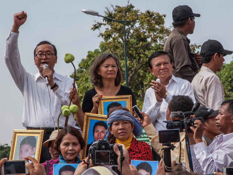 Leaders of the opposition Cambodia National Rescue Party, (from left) Sam Rainsy, Mu Sochua and Kem Sokha, give speeches in Phnom Penh in 2014. Rainsy and Sochua now live in self-imposed exile outside the country, while Sokha has been jailed since 2017. Leaders of the opposition Cambodia National Rescue Party, (from left) Sam Rainsy, Mu Sochua and Kem Sokha, give speeches in Phnom Penh in 2014. Rainsy and Sochua now live in self-imposed exile outside the country, while Sokha has been jailed since 2017.