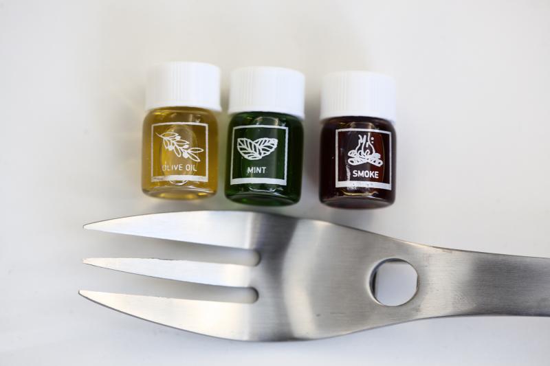 The "Aroma R-evolution" kit comes with four forks and 21 vials full of aromas like olive oil, mint and smoke. You drop a dab of scented liquid onto the base of the fork, and the smell is supposed to subtly flavor the food you eat while using the utensil. The "Aroma R-evolution" kit comes with four forks and 21 vials full of aromas like olive oil, mint and smoke. You drop a dab of scented liquid onto the base of the fork, and the smell is supposed to subtly flavor the food you eat while using the utensil.