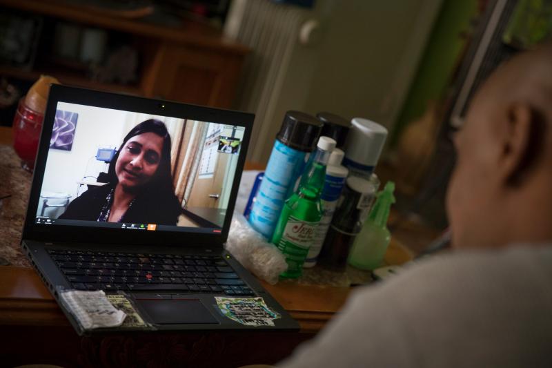 Dr. Gita Agarwal of Mary's Center conducts a telemedicine conference with Dennis Dolman from his mother's house in Washington, D.C. Dr. Gita Agarwal of Mary's Center conducts a telemedicine conference with Dennis Dolman from his mother's house in Washington, D.C.