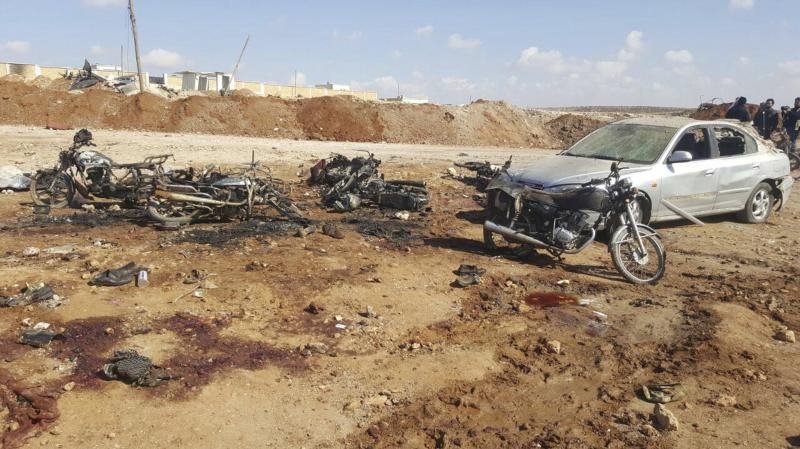 Burned, twisted metal from motorcycles covered an area where a suicide attacker blew up his small pickup truck outside a security office on Friday in the village of Sousian in northern Syria. Burned, twisted metal from motorcycles covered an area where a suicide attacker blew up his small pickup truck outside a security office on Friday in the village of Sousian in northern Syria.