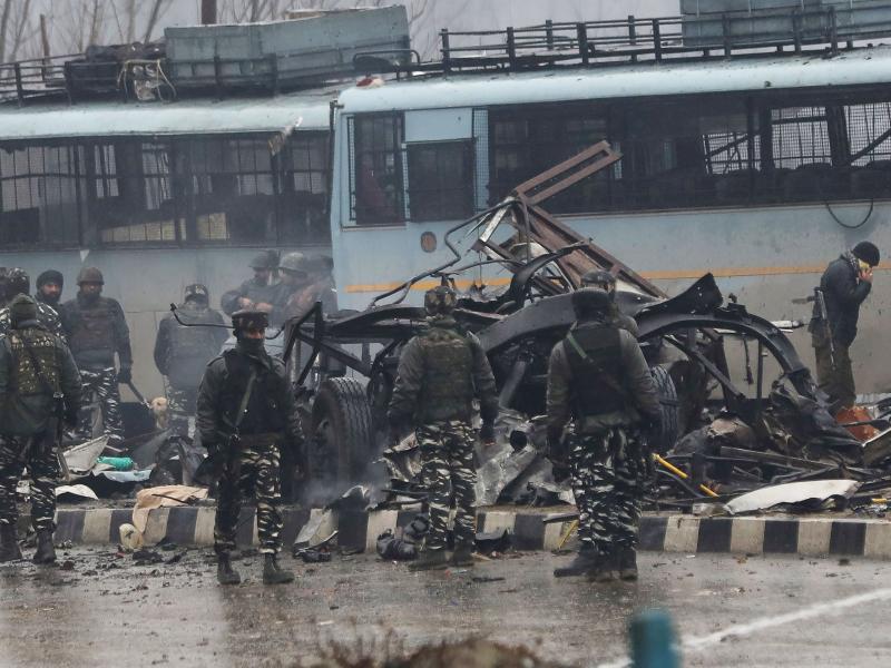 Indian security forces inspect the remains of a vehicle following an attack on a Central Reserve Police Force convoy that killed at least 44 officers and injured several others in Kashmir south of Srinagar on Thursday. Indian security forces inspect the remains of a vehicle following an attack on a Central Reserve Police Force convoy that killed at least 44 officers and injured several others in Kashmir south of Srinagar on Thursday.