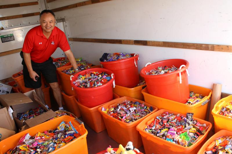 Dr. Curtis Chan, a dentist in Del Mar, Calif., loads up a truck with 5,456 pounds of candy to deliver to Operation Gratitude during the Halloween Candy Buyback on Nov. 8 last year. Chan personally collected 3,542 pounds of candy from patients. Dr. Curtis Chan, a dentist in Del Mar, Calif., loads up a truck with 5,456 pounds of candy to deliver to Operation Gratitude during the Halloween Candy Buyback on Nov. 8 last year. Chan personally collected 3,542 pounds of candy from patients.