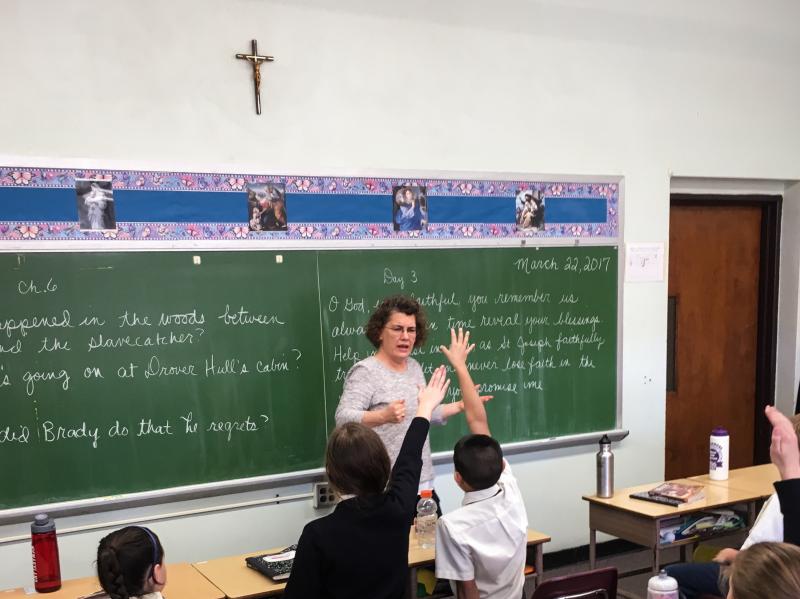 Amy Clayton teaches a fifth-grade history class at St. Jerome Academy in Hyattsville, Md. The school, which almost closed eight years ago, has experienced growth over the past few years, largely due to an influx of Catholic families who were drawn to Hyat Amy Clayton teaches a fifth-grade history class at St. Jerome Academy in Hyattsville, Md. The school, which almost closed eight years ago, has experienced growth over the past few years, largely due to an influx of Catholic families who were drawn to Hyat