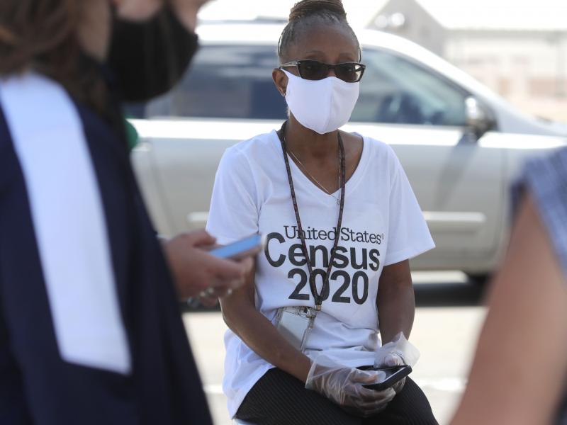 U.S. Census Bureau worker Jennifer Pope wears a face covering at a walk-up counting site in Greenville, Texas, on July 31. The bureau is ending all counting efforts for the 2020 census on Sept. 30, a month shorter than previously announced, the bureau's d U.S. Census Bureau worker Jennifer Pope wears a face covering at a walk-up counting site in Greenville, Texas, on July 31. The bureau is ending all counting efforts for the 2020 census on Sept. 30, a month shorter than previously announced, the bureau's d