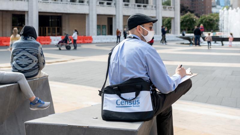 A U.S. census worker sits in the plaza of the Lincoln Center for the Performing Arts in New York City in September. The Census Bureau announced Wednesday that the first results of the 2020 census are expected to be released by April 30. A U.S. census worker sits in the plaza of the Lincoln Center for the Performing Arts in New York City in September. The Census Bureau announced Wednesday that the first results of the 2020 census are expected to be released by April 30.