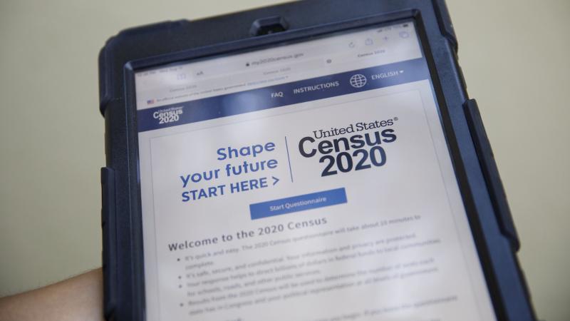 A volunteer in Los Angeles holds a computer tablet displaying the online questionnaire for the 2020 census in August. A volunteer in Los Angeles holds a computer tablet displaying the online questionnaire for the 2020 census in August.