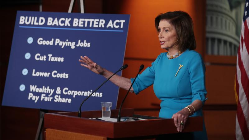 House Speaker Nancy Pelosi, D-Calif., talks to reporters ahead of House passage of Democrats' Build Back Better Act, which now faces changes in the Senate. House Speaker Nancy Pelosi, D-Calif., talks to reporters ahead of House passage of Democrats' Build Back Better Act, which now faces changes in the Senate.
