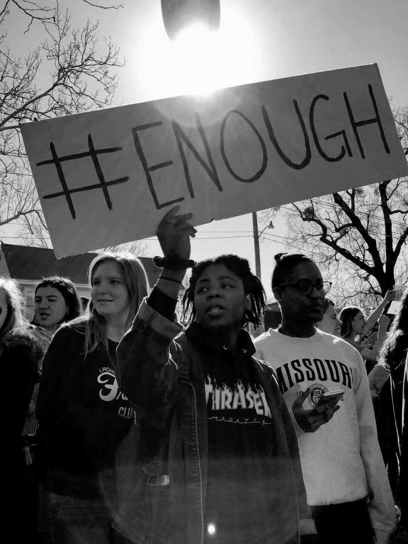 Students hold signs reading "#ENOUGH" during Central High School's walkout on Wednesday. Students hold signs reading "#ENOUGH" during Central High School's walkout on Wednesday.