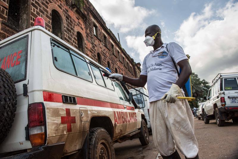 At the main ambulance base in central Freetown, Sierra Leone, a government health worker disinfects ambulances with chlorine spray during the 2014 Ebola outbreak. At the main ambulance base in central Freetown, Sierra Leone, a government health worker disinfects ambulances with chlorine spray during the 2014 Ebola outbreak.