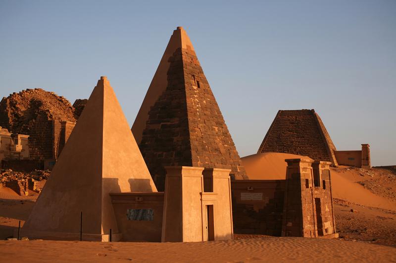 Several pyramids in the morning light in the royal burial grounds in Meroe, Sudan. Several pyramids in the morning light in the royal burial grounds in Meroe, Sudan.