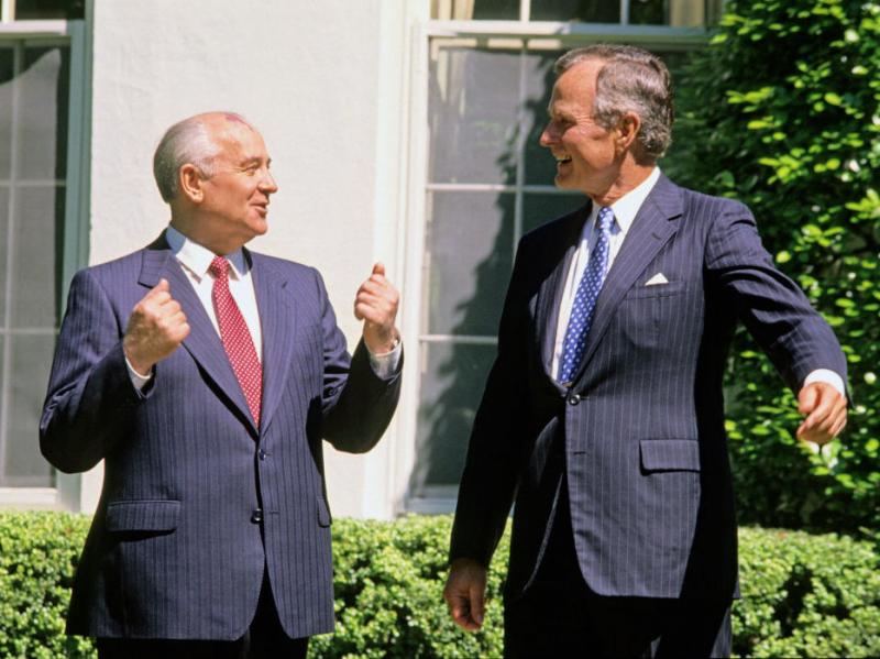 Soviet President Mikhail Gorbachev (left) and former U.S. President George H.W. Bush share a light moment together outside the White House in 1990. Could they be discussing chicken? Soviet President Mikhail Gorbachev (left) and former U.S. President George H.W. Bush share a light moment together outside the White House in 1990. Could they be discussing chicken?