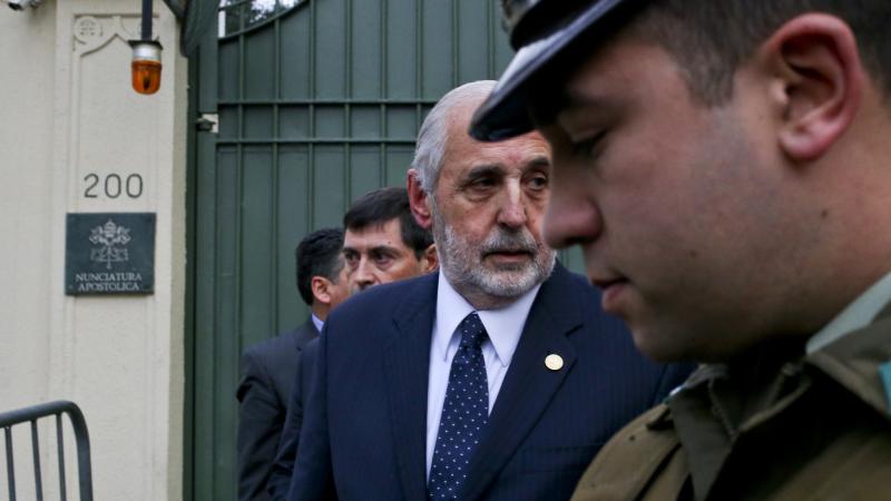 Chile's National Prosecutor Jorge Abbott, center, leaves the Apostolic Nunciature after meeting with Archbishop Charles Scicluna in Santiago, Chile. Police raided Roman Catholic Church offices in two Chilean cities Wednesday looking for files related to a Chile's National Prosecutor Jorge Abbott, center, leaves the Apostolic Nunciature after meeting with Archbishop Charles Scicluna in Santiago, Chile. Police raided Roman Catholic Church offices in two Chilean cities Wednesday looking for files related to a