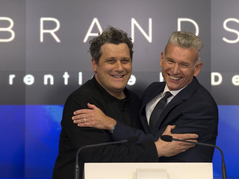 Designer Isaac Mizrahi (left) embraces Robert D'Loren, CEO of Xcel Brands, which once manufactured 70% of its clothes in China. Today that's down to about 20%. The company now manufacturers in a variety of countries, including Indonesia, India and Sri Lan Designer Isaac Mizrahi (left) embraces Robert D'Loren, CEO of Xcel Brands, which once manufactured 70% of its clothes in China. Today that's down to about 20%. The company now manufacturers in a variety of countries, including Indonesia, India and Sri Lan