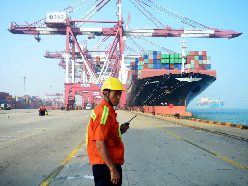 A Chinese worker looks on as a cargo ship is loaded at a port in Qingdao, in eastern China's Shandong province, in July 2017. The United States is China's biggest single export market. A Chinese worker looks on as a cargo ship is loaded at a port in Qingdao, in eastern China's Shandong province, in July 2017. The United States is China's biggest single export market.