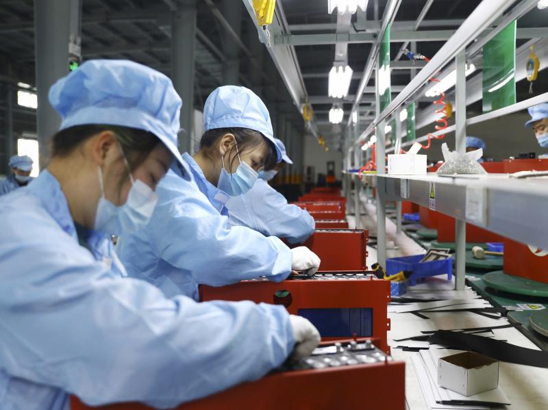Employees work in the workshop of a lithium battery manufacturing company in Huaibei, eastern China, on Nov. 14. China posted a record trade surplus in November, led by a surge in exports to the United States. Employees work in the workshop of a lithium battery manufacturing company in Huaibei, eastern China, on Nov. 14. China posted a record trade surplus in November, led by a surge in exports to the United States.