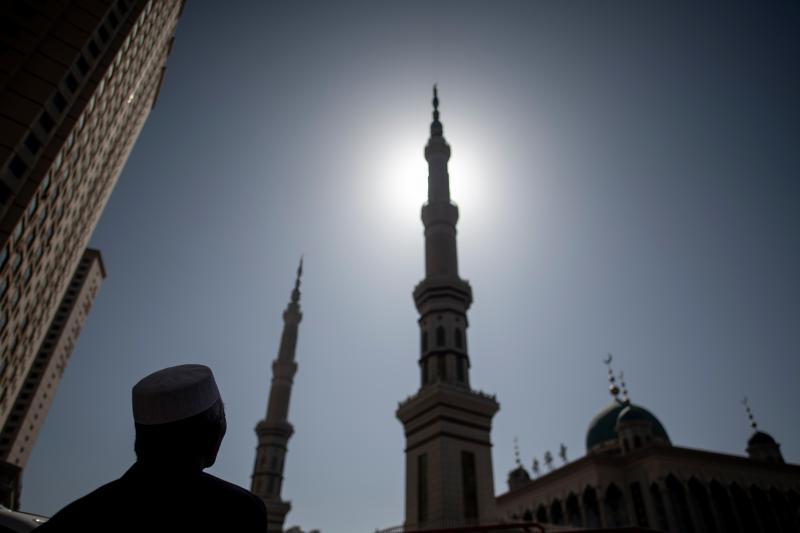 An ethnic Hui Muslim man stands in front of Laohuasi Mosque in Linxia, Gansu province, in 2018. Chinese Muslims are most densely clustered in the northwestern regions of Gansu, Ningxia and Xinjiang, but live across the country, as they have for more than An ethnic Hui Muslim man stands in front of Laohuasi Mosque in Linxia, Gansu province, in 2018. Chinese Muslims are most densely clustered in the northwestern regions of Gansu, Ningxia and Xinjiang, but live across the country, as they have for more than