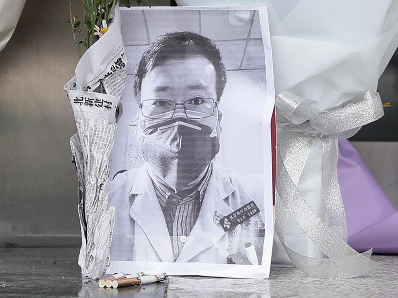 A photo of the late ophthalmologist Li Wenliang at a hospital in Wuhan, China, on Friday. Li, who is being hailed for his efforts to alert the medical profession to the new virus, died Friday after becoming infected. A photo of the late ophthalmologist Li Wenliang at a hospital in Wuhan, China, on Friday. Li, who is being hailed for his efforts to alert the medical profession to the new virus, died Friday after becoming infected.