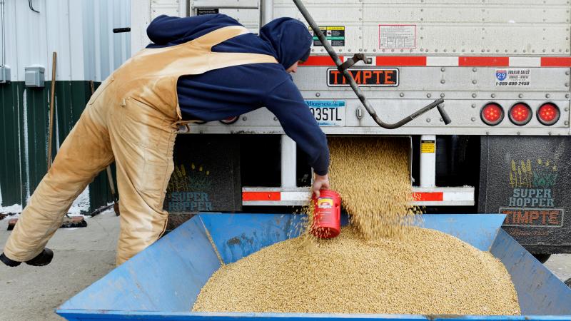 China currently buys nearly a third of the U.S. soybean crop — but the country plans to impose tariffs, in response to a Trump administration plan. Here, a worker takes a sample from a truckload of soybeans in Fargo, N.D., last December. China currently buys nearly a third of the U.S. soybean crop — but the country plans to impose tariffs, in response to a Trump administration plan. Here, a worker takes a sample from a truckload of soybeans in Fargo, N.D., last December.