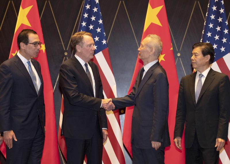 U.S. Trade Representative Robert Lighthizer (center left) shakes hands with Chinese Vice Premier Liu He at a conference center in Shanghai on July 31. Trade talks are expected to resume in September. U.S. Trade Representative Robert Lighthizer (center left) shakes hands with Chinese Vice Premier Liu He at a conference center in Shanghai on July 31. Trade talks are expected to resume in September.