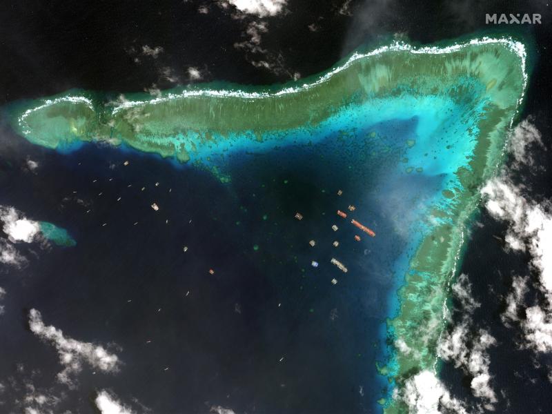 Overview of Whitsun Reef in the South China Sea and Chinese vessels moored in the waters surrounding the boomerang-shaped coral reef on March 23. Overview of Whitsun Reef in the South China Sea and Chinese vessels moored in the waters surrounding the boomerang-shaped coral reef on March 23.