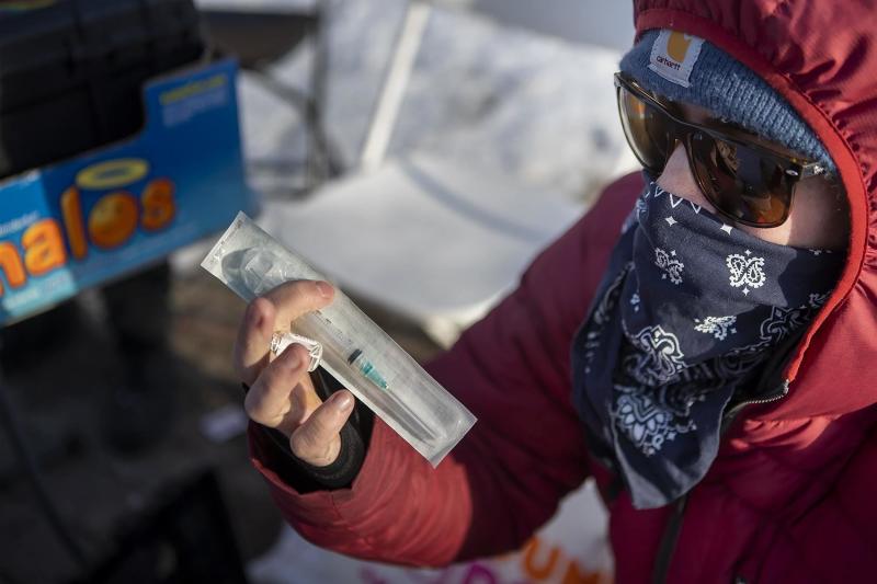 A man who goes by the name Dave Carvagio holds a packaged syringe in Pickering Square in Bangor, Maine. The Bangor chapter of the Church of Safe Injection sets up a table in the square and offers free naloxone, needles and other drug-using supplies. A man who goes by the name Dave Carvagio holds a packaged syringe in Pickering Square in Bangor, Maine. The Bangor chapter of the Church of Safe Injection sets up a table in the square and offers free naloxone, needles and other drug-using supplies.