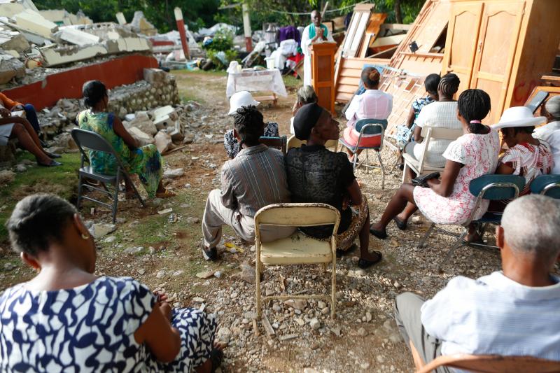 Rev. Jean Eddy Desravines, 61, of Sainte-Agnes Catholic Church near Les Cayes, Haiti, celebrates Mass on Sunday. The church sanctuary was destroyed in the 7.2 magnitude earthquake that struck earlier this month. Rev. Jean Eddy Desravines, 61, of Sainte-Agnes Catholic Church near Les Cayes, Haiti, celebrates Mass on Sunday. The church sanctuary was destroyed in the 7.2 magnitude earthquake that struck earlier this month.