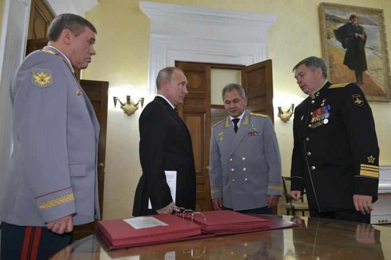 Russian President Vladimir Putin (second from left) meets military officials, including Igor Kostyukov (far right), the deputy chief of military intelligence for the GRU. The 2018 event in Moscow marked the centenary of the GRU, which has been involved in Russian President Vladimir Putin (second from left) meets military officials, including Igor Kostyukov (far right), the deputy chief of military intelligence for the GRU. The 2018 event in Moscow marked the centenary of the GRU, which has been involved in
