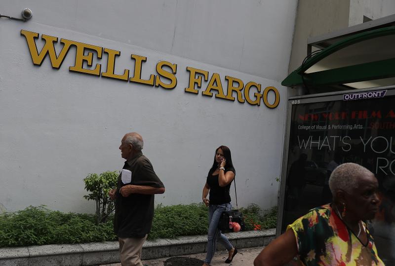 People walk in front of a Wells Fargo branch on Sept. 9, 2016 in Miami, Fla. On Monday, the U.S. Supreme Court ruled that the city of Miami can sue Wells Fargo and Bank of America under the Fair Housing Act for damages caused by allegedly predatory and di People walk in front of a Wells Fargo branch on Sept. 9, 2016 in Miami, Fla. On Monday, the U.S. Supreme Court ruled that the city of Miami can sue Wells Fargo and Bank of America under the Fair Housing Act for damages caused by allegedly predatory and di