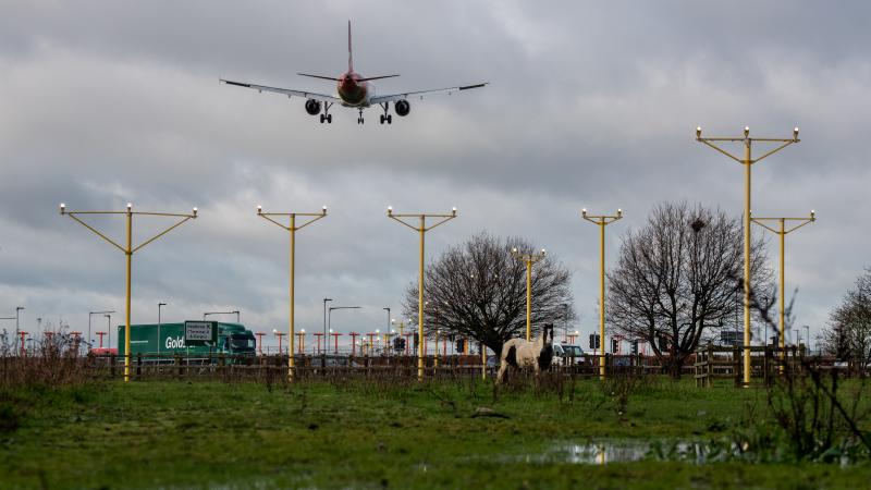 An airplane arrives at London's Heathrow Airport on Thursday — the same day a court blocked plans for a third runway at the airport, citing the government's climate change commitments. An airplane arrives at London's Heathrow Airport on Thursday — the same day a court blocked plans for a third runway at the airport, citing the government's climate change commitments.