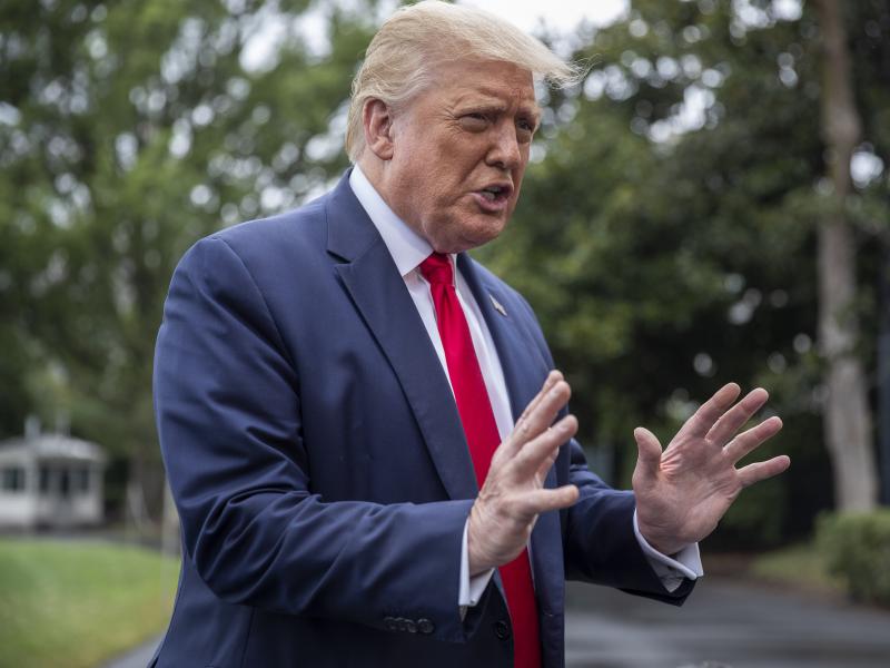 President Donald Trump chats with reporters Friday as he heads to Marine One on the South Lawn of the White House. The day before, he floated the idea of delaying the election, prompting criticism from the Federalist Society's co-founder. President Donald Trump chats with reporters Friday as he heads to Marine One on the South Lawn of the White House. The day before, he floated the idea of delaying the election, prompting criticism from the Federalist Society's co-founder.
