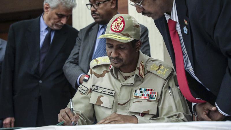 Gen. Mohammed Hamdan Dagalo signs a power sharing agreement with Sudan's pro-democracy movement and the ruling military council in Khartoum, Sudan. Gen. Mohammed Hamdan Dagalo signs a power sharing agreement with Sudan's pro-democracy movement and the ruling military council in Khartoum, Sudan.