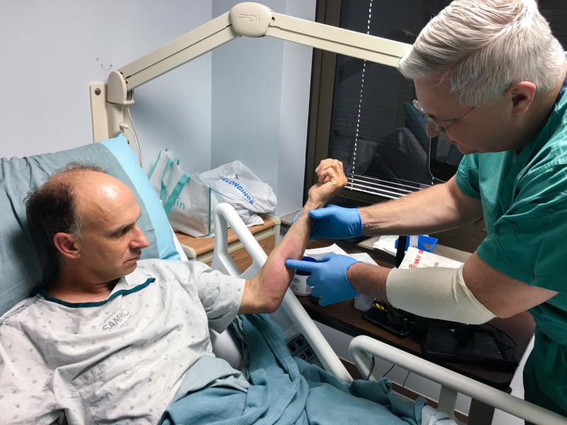 Physician assistant James Williams, right, describes the treatment of burn patients as "a very tactile type of medicine." Physician assistant James Williams, right, describes the treatment of burn patients as "a very tactile type of medicine."