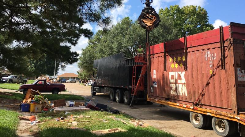 Cleanup crews roll through East Baton Rouge picking up debris from massive floods that ravaged the state last week. Cleanup crews roll through East Baton Rouge picking up debris from massive floods that ravaged the state last week.