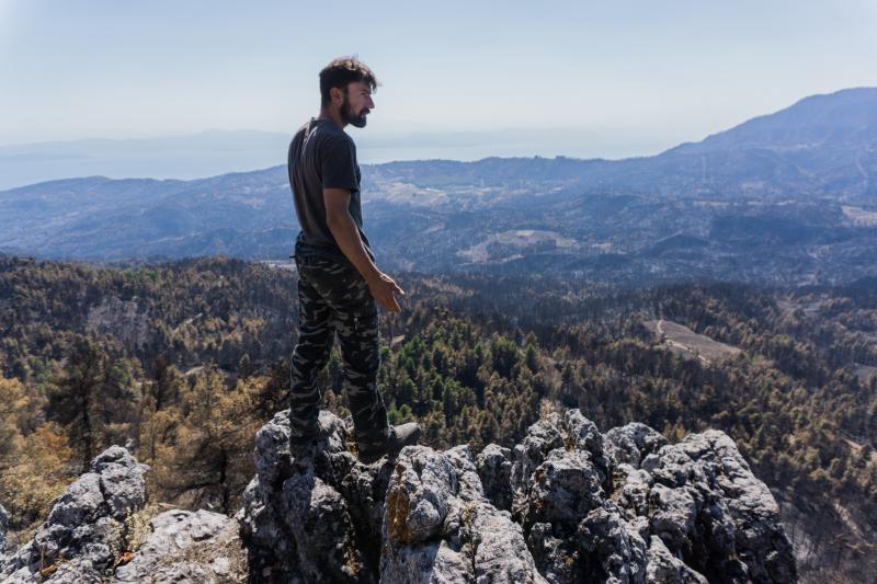 "This used to be paradise. Now it's hell," says pine resin producer Giorgos Anagnostou, 38, standing on top of a mountain near his village of Kourkouloi in northern Evia. The fire wiped out the forest's pine trees and his livelihood. "This used to be paradise. Now it's hell," says pine resin producer Giorgos Anagnostou, 38, standing on top of a mountain near his village of Kourkouloi in northern Evia. The fire wiped out the forest's pine trees and his livelihood.